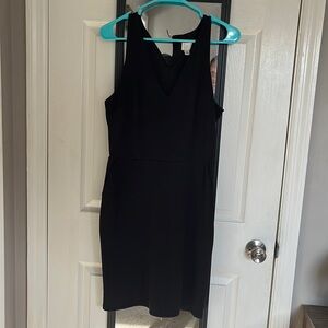 Knee length black business dress with pockets
